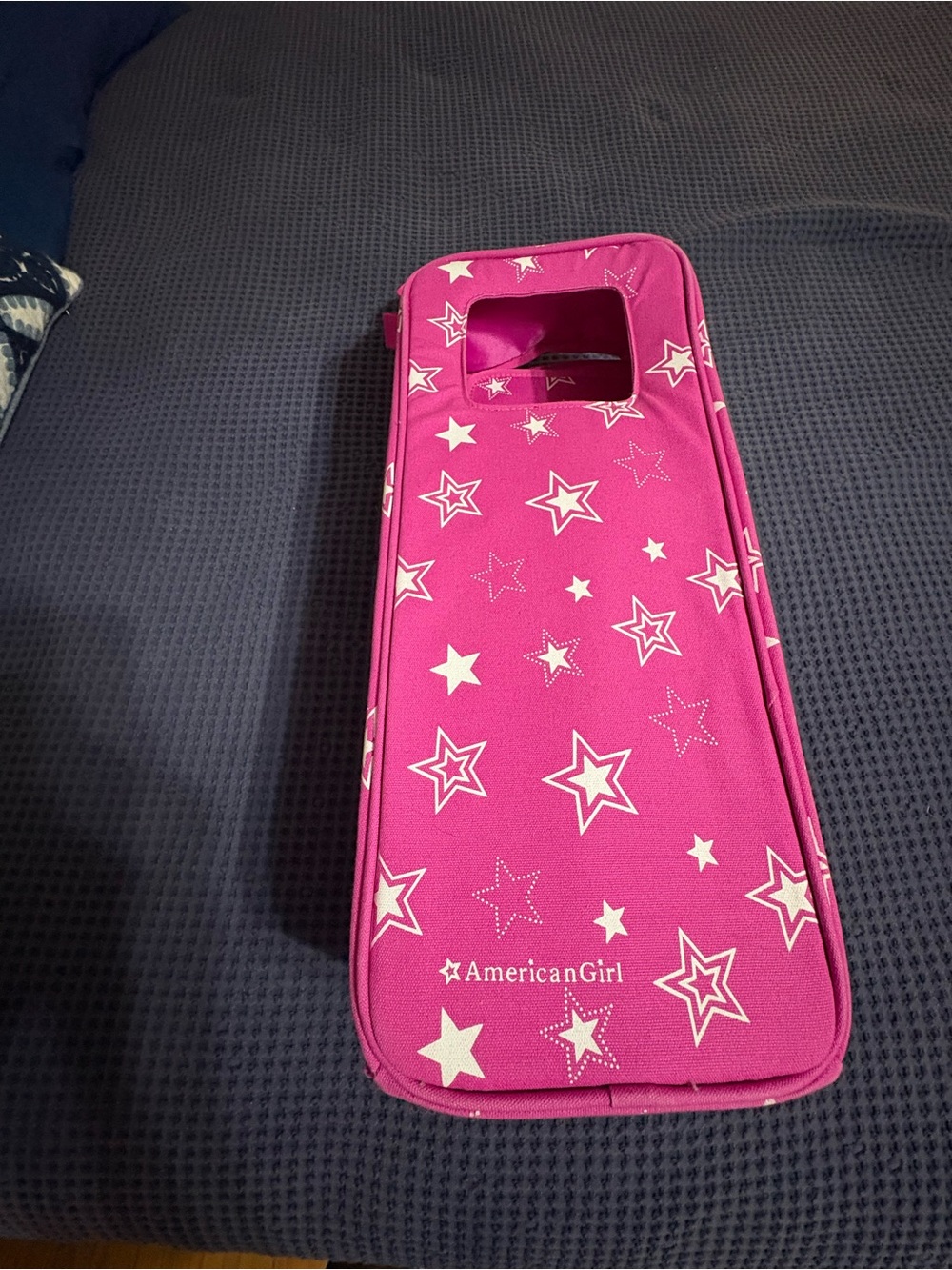 American Girl Hot Pink Star Print Doll Carrier with accessories compartments.